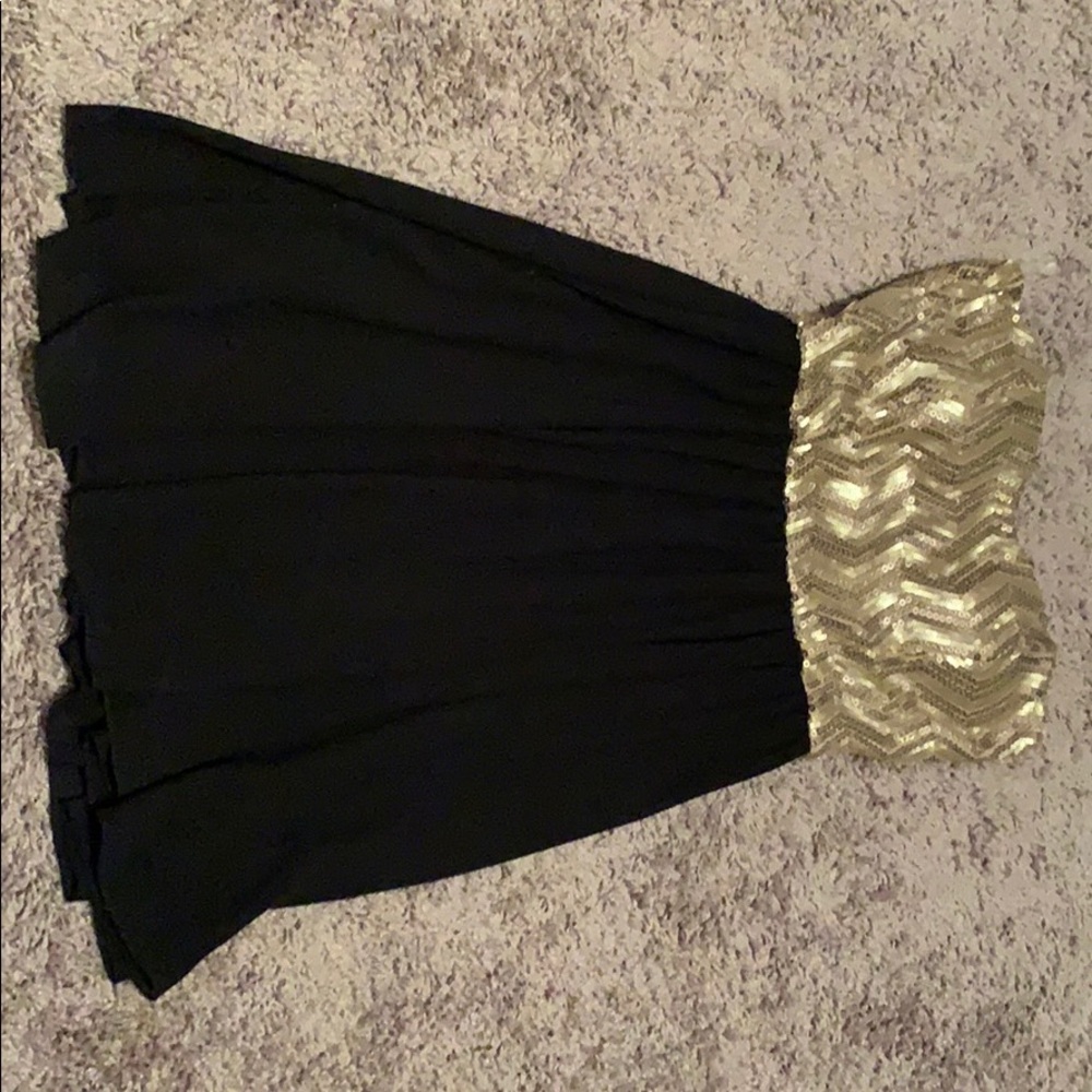 Gold and black sequin dress.